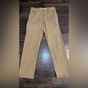 30x32 Mens Carhartt Pants. Note stain on knee.